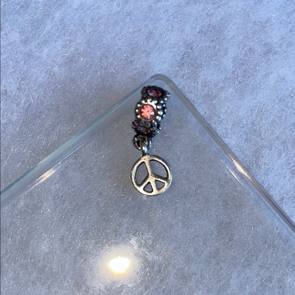 Pandora Silverwith Pink stone and peace sign charm